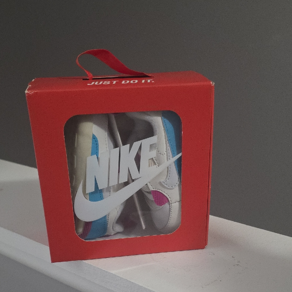 Nike White and Blue Shoes with Pink Highlights
